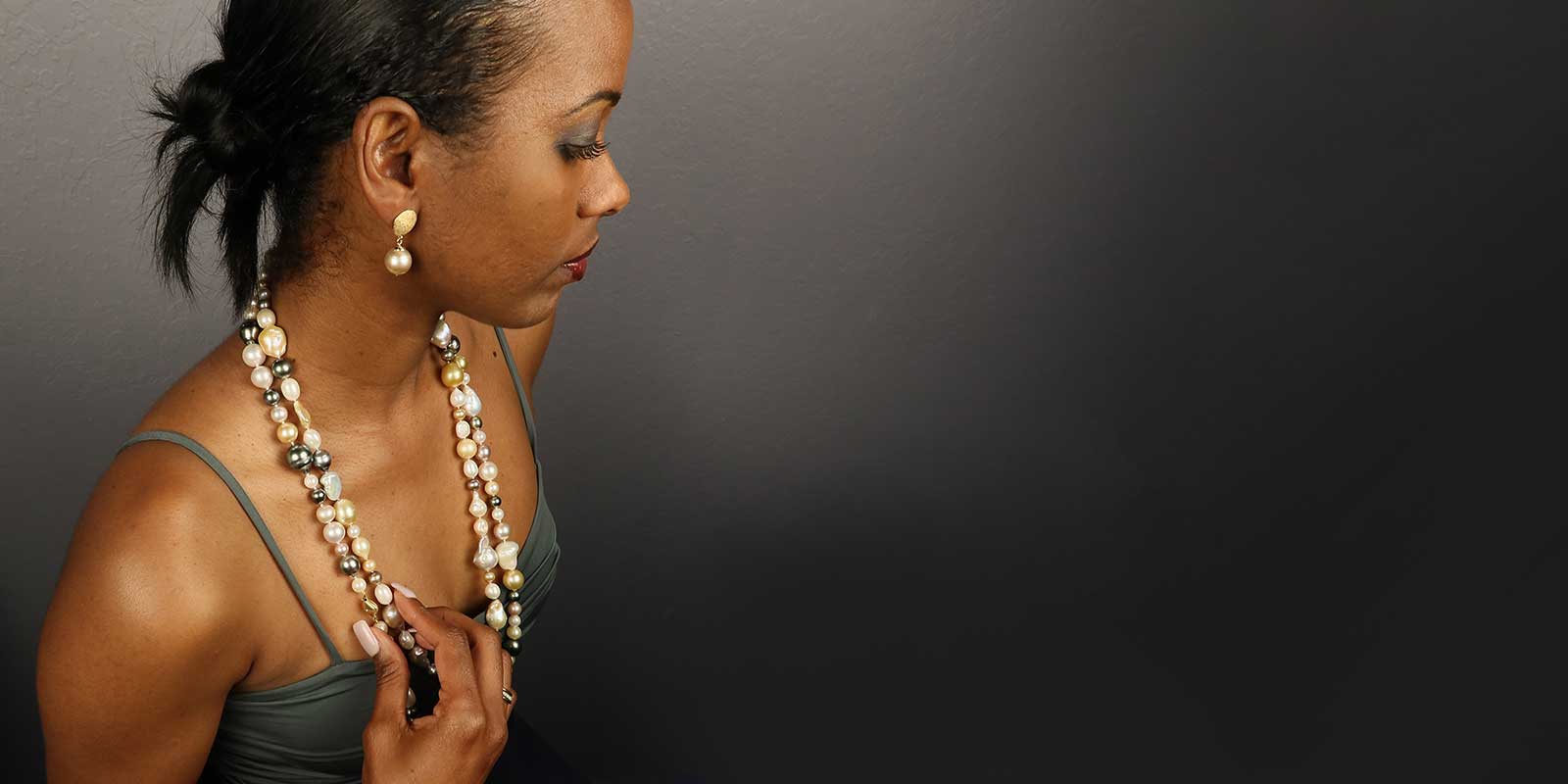 model wearing double strand pearl necklace and pearl earrings Jewelsmith Durham NC