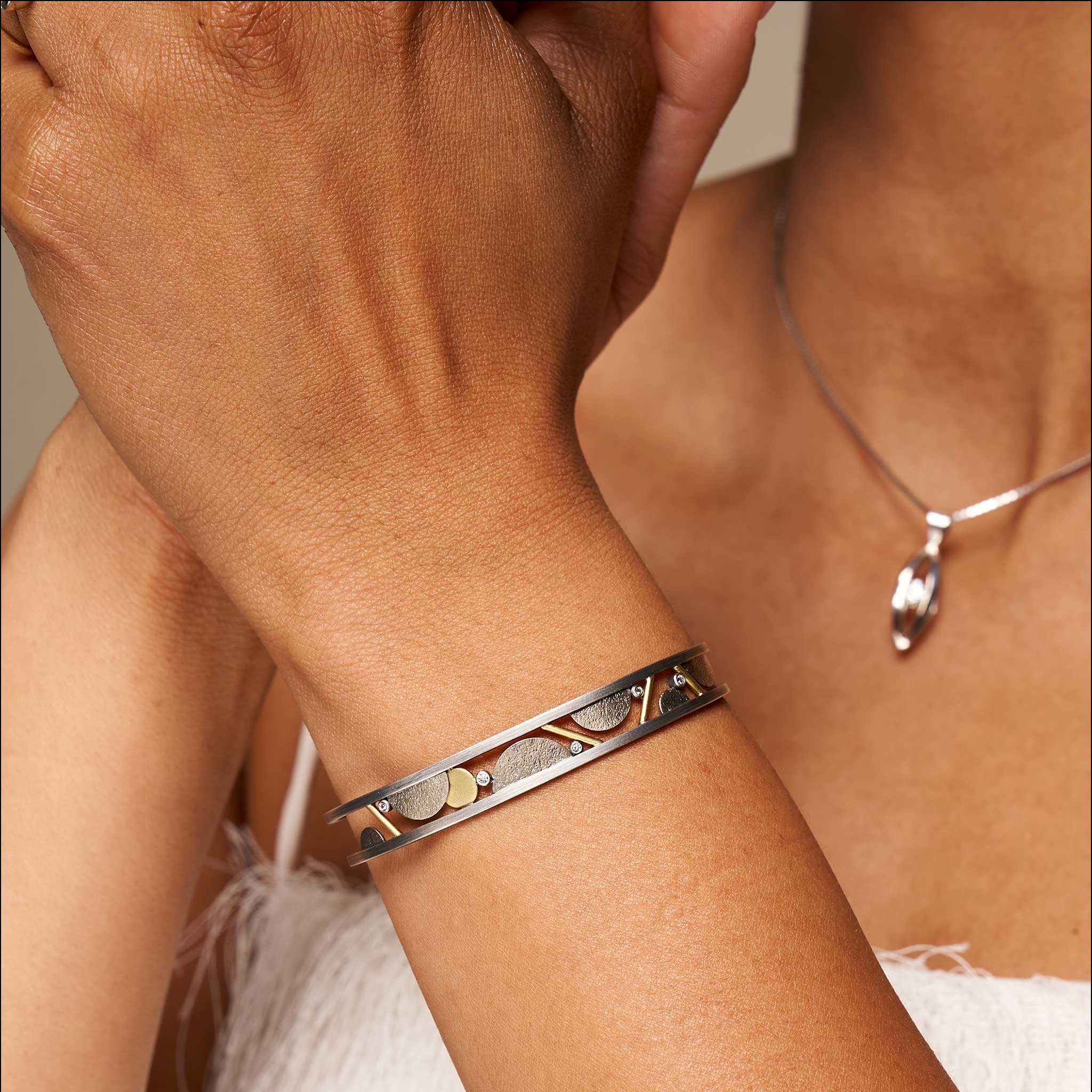 diamond half circles and lines cuff bracelet on model