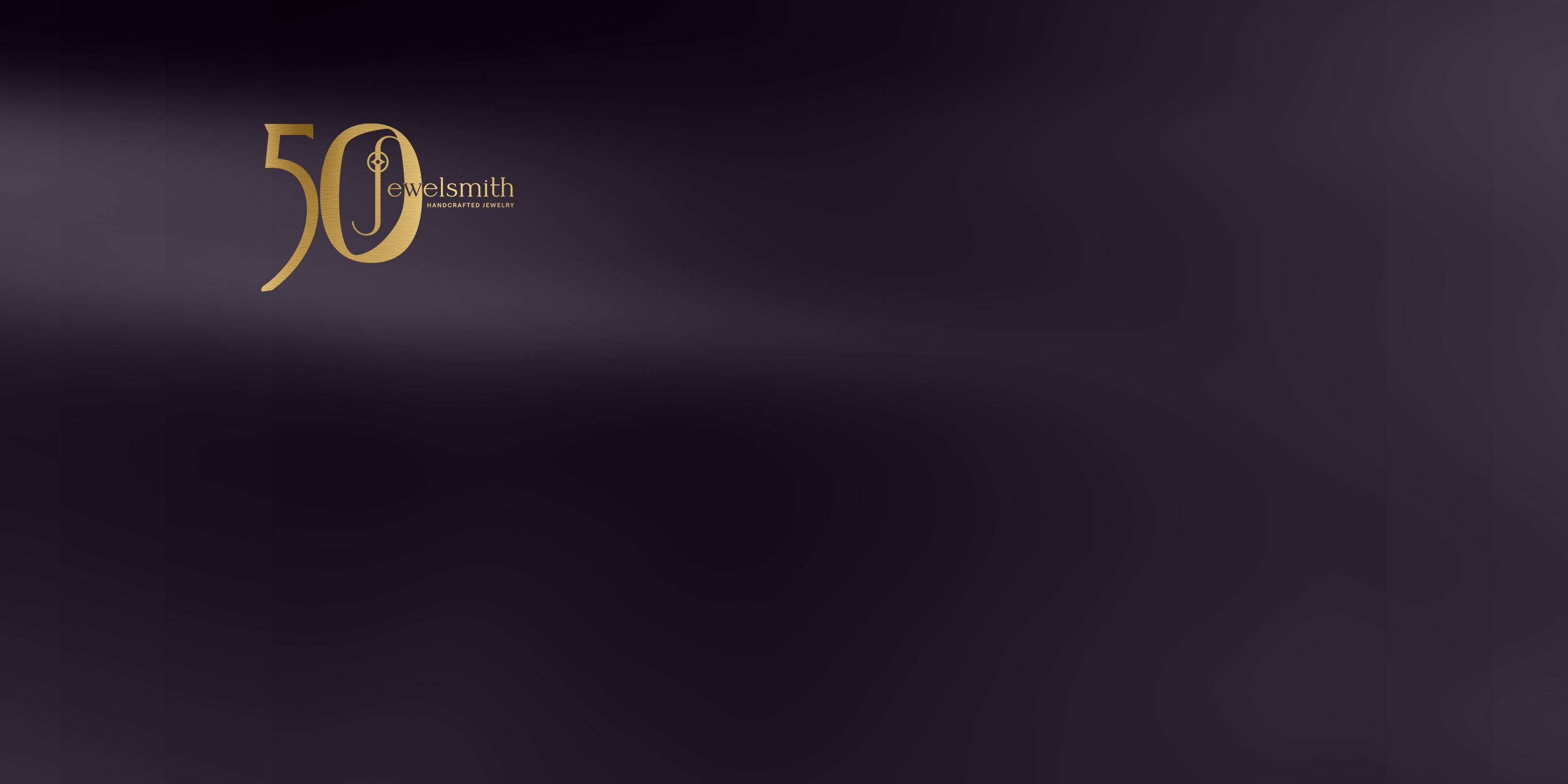 Gold '50' Jewelsmith logo on a dark background