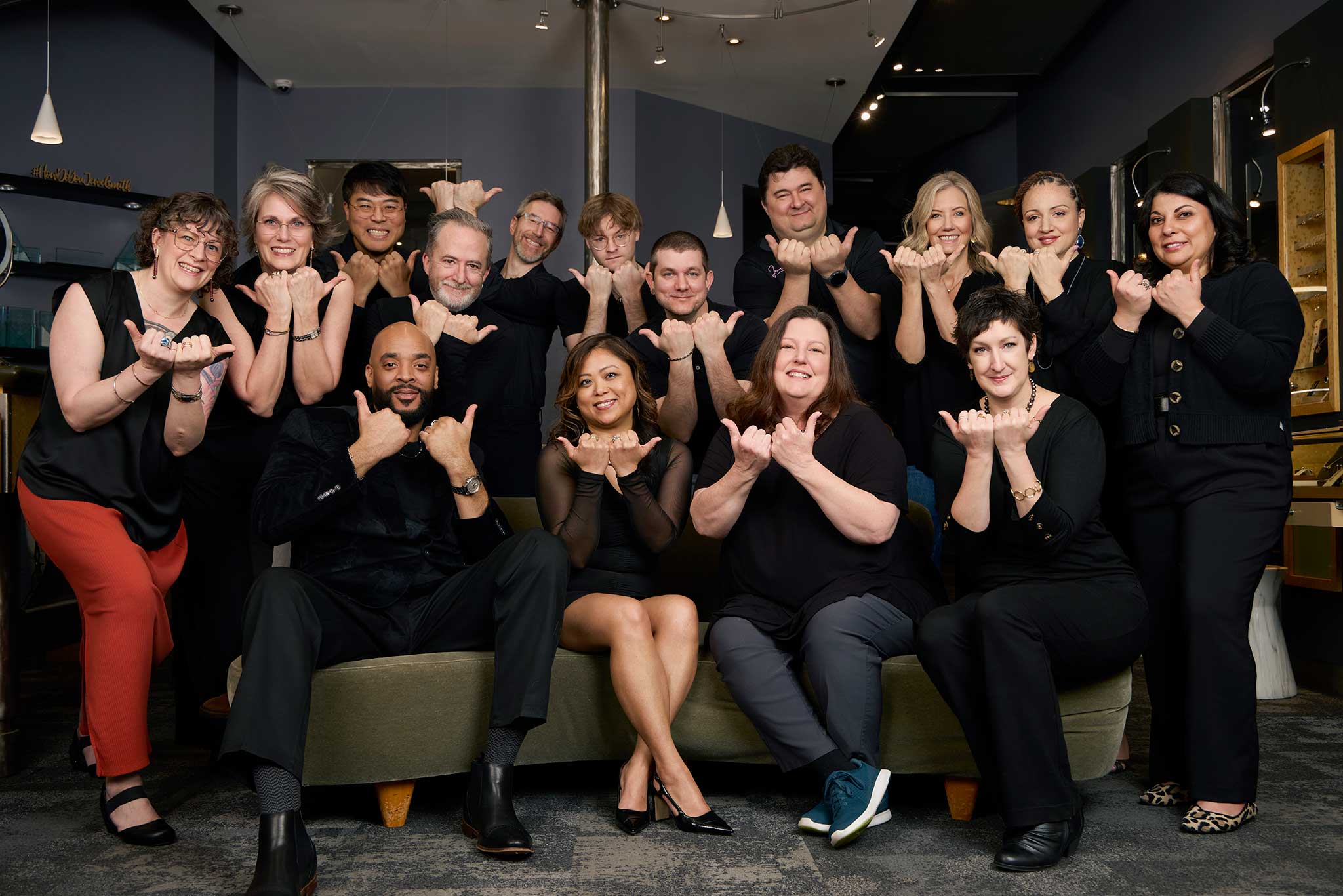 Jewelsmith team photo with hands in the bull city sign in Durham, NC