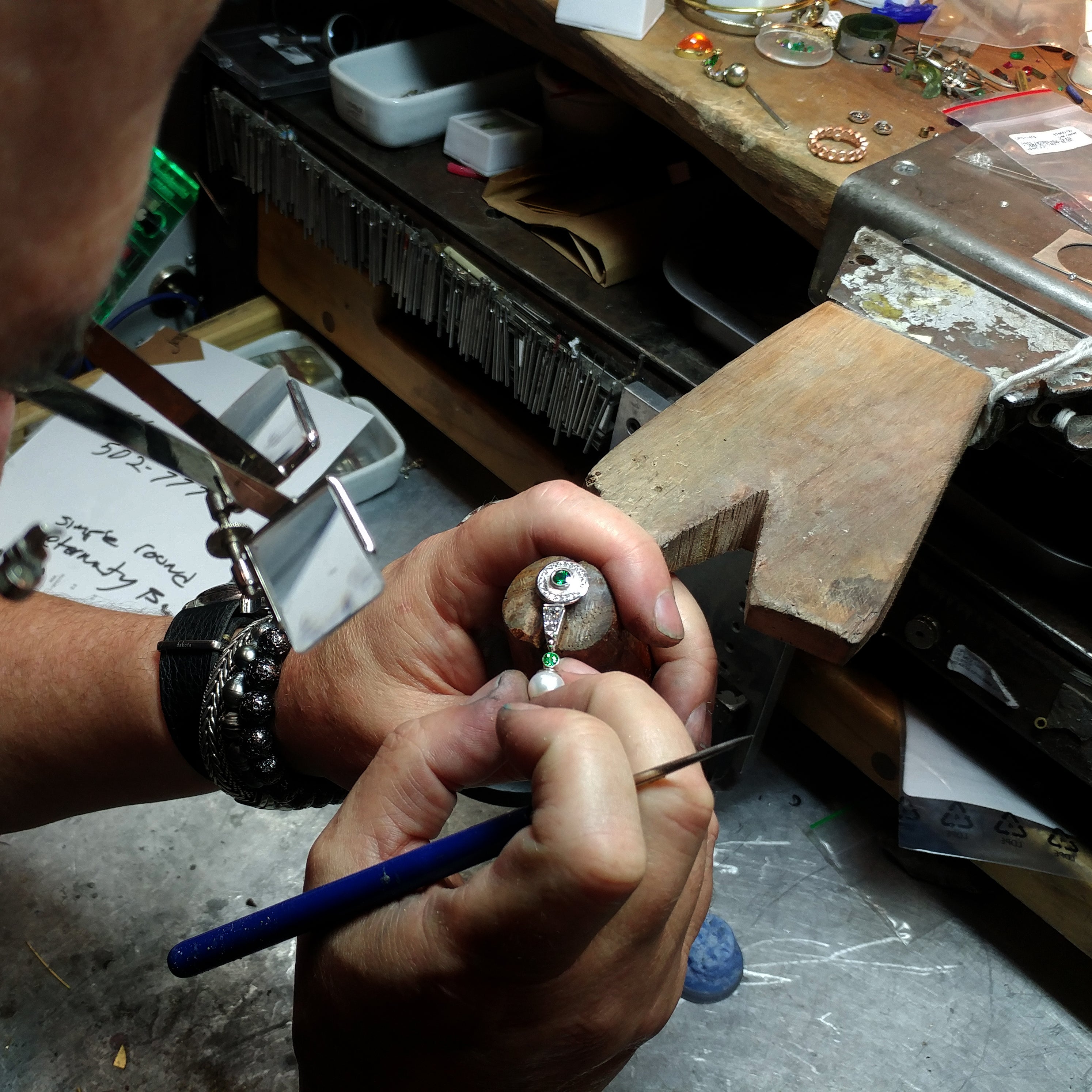 jeweler inspecting custom made earring