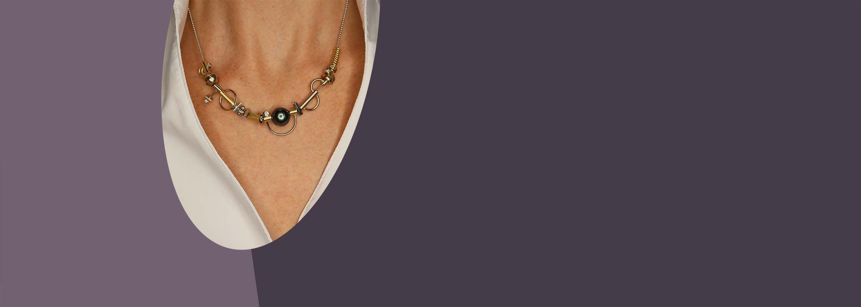 dark and light purple banner with model wearing Jewelsmith Parts necklace, Durham, NC