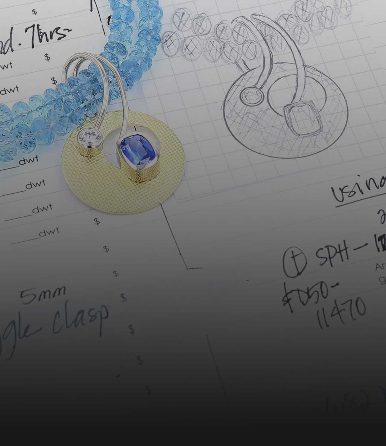 custom sapphire and diamond pendant on aquamarine bead strand necklace next to design sketch and notes