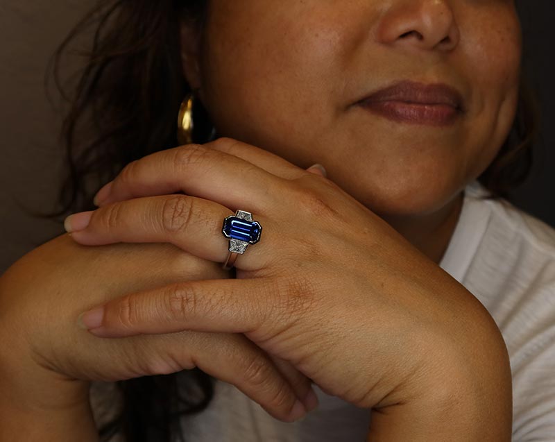 model wearing sapphire diamond ring