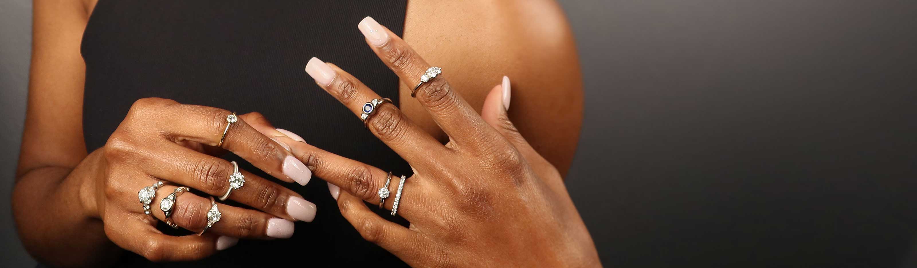 model wearing multiple engagement rings