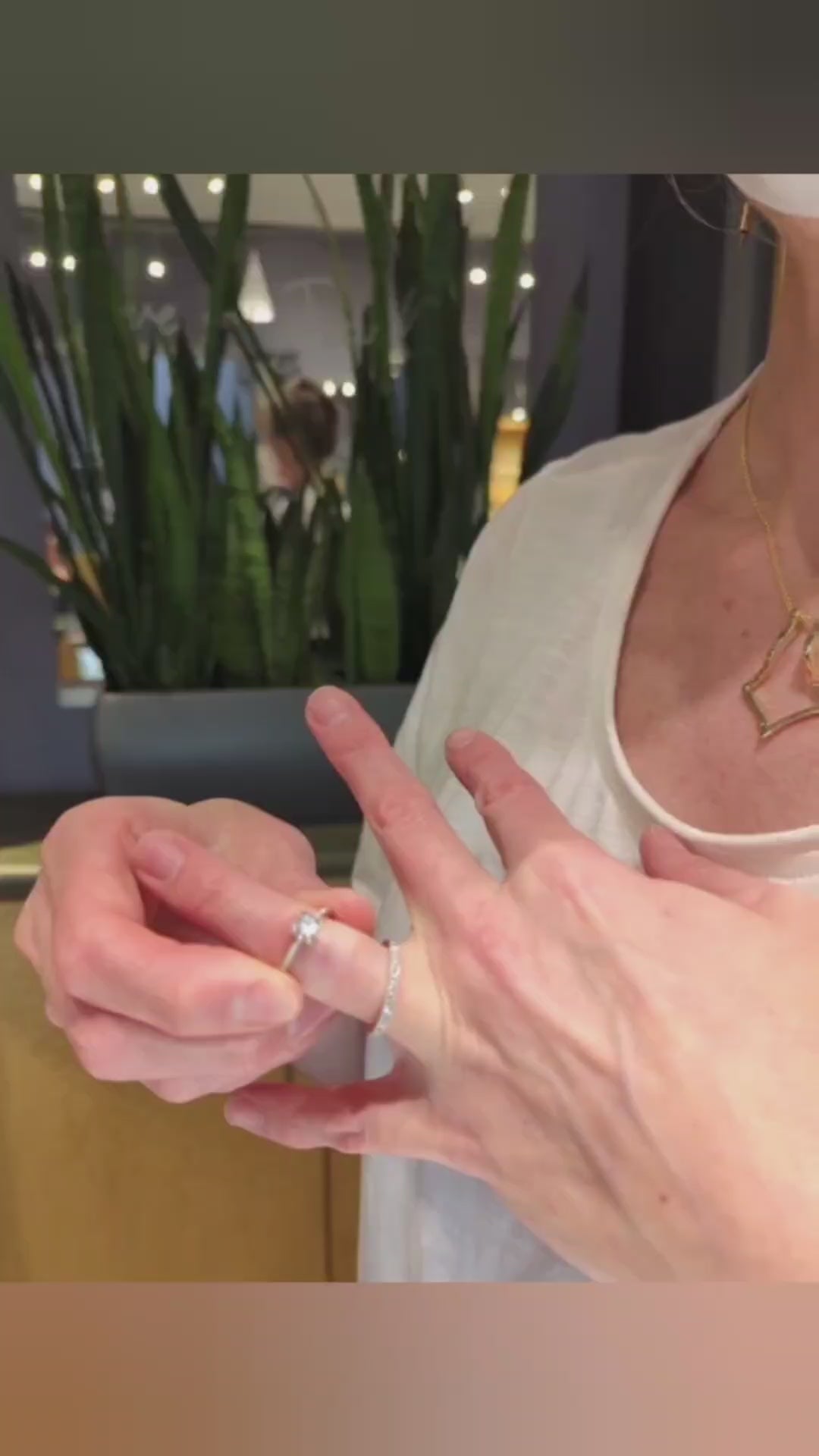 Tiffany demonstrates how to put ring on ring holder pendant without removing pendant