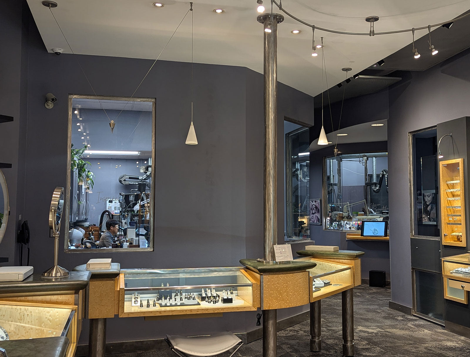 View of Jewelsmith Interior with Goldsmith Shop Visible Through Windows in Durham, NC