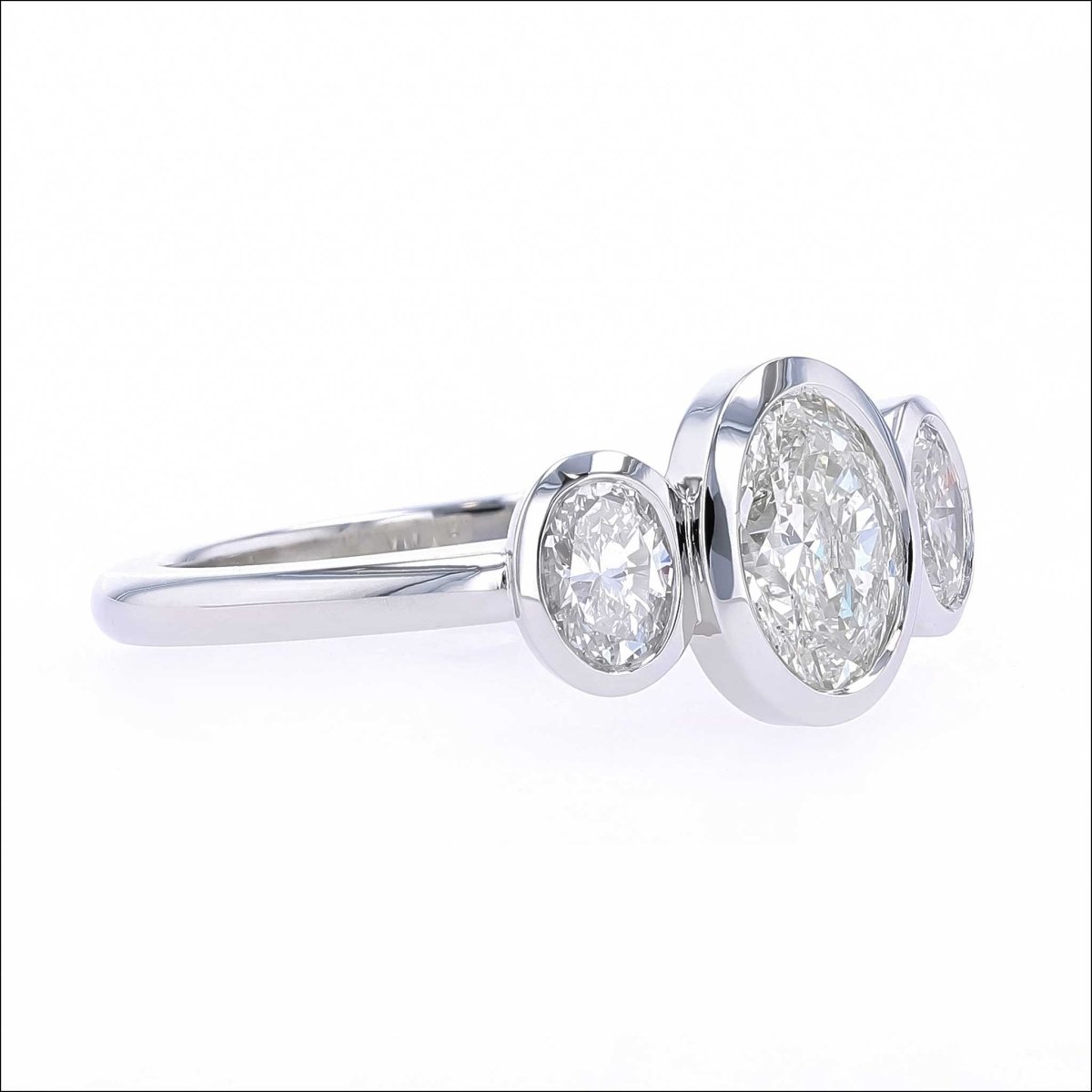 Three Stone Oval Diamond Floating Bezel Engagement Ring Platinum - JewelsmithEngagement Rings