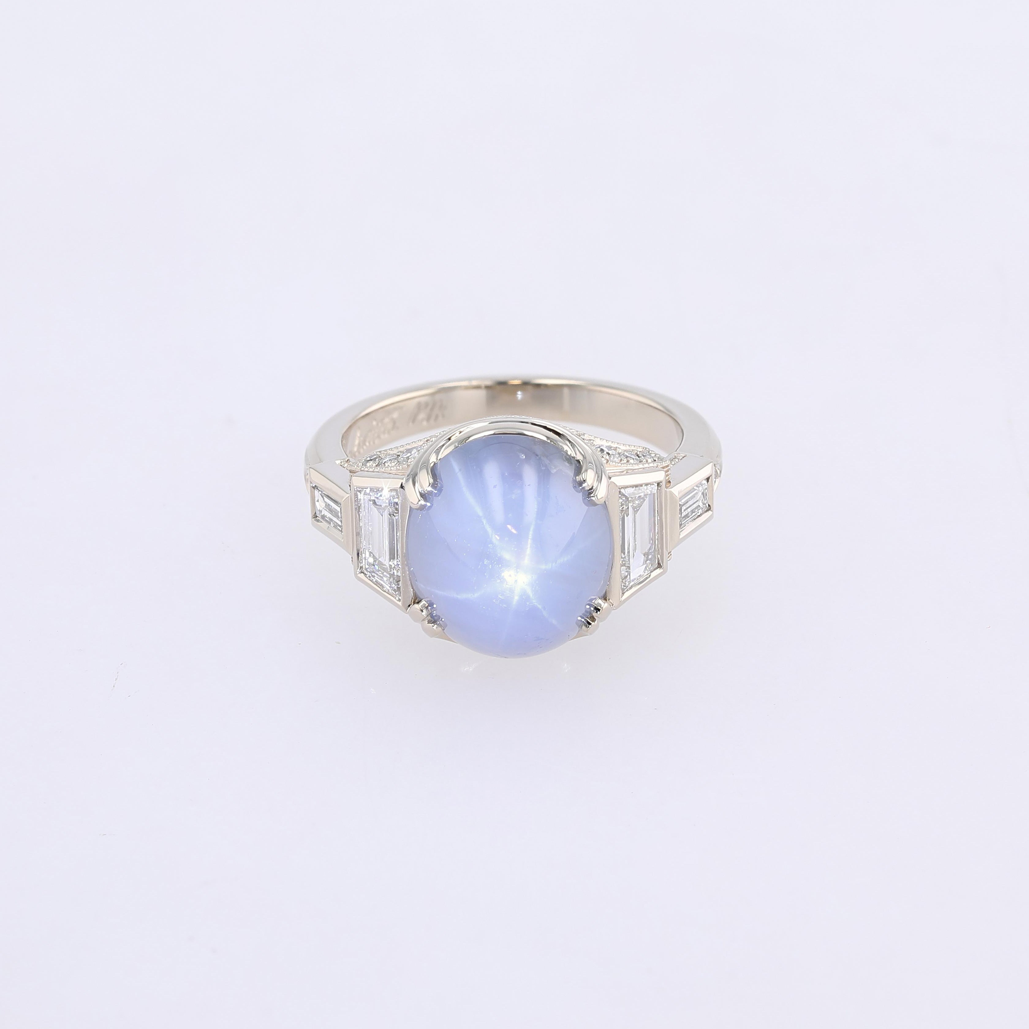 star sapphire ring with trapezoid and baguette sides and engraved details
