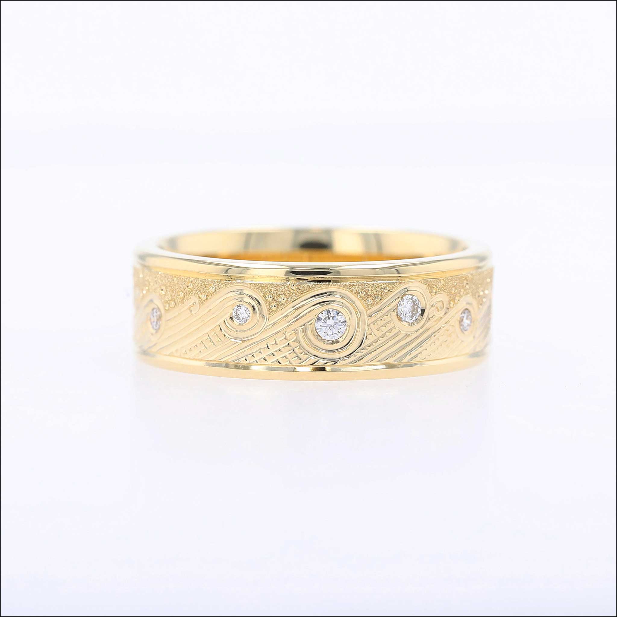 Hand engraved wave pattern ring with diamonds