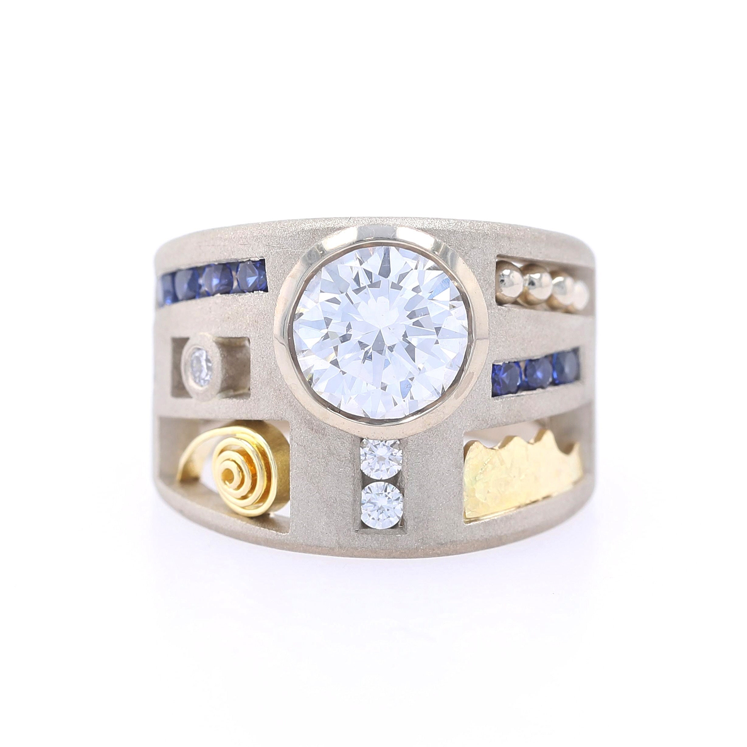 diamond and sapphire parts ring in white gold and gold accents