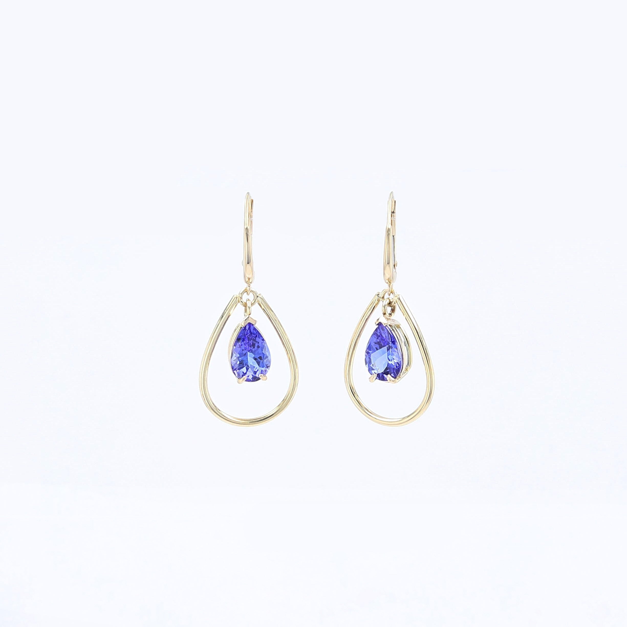 pear shaped blue sapphires in teardrop shaped dangle earrings