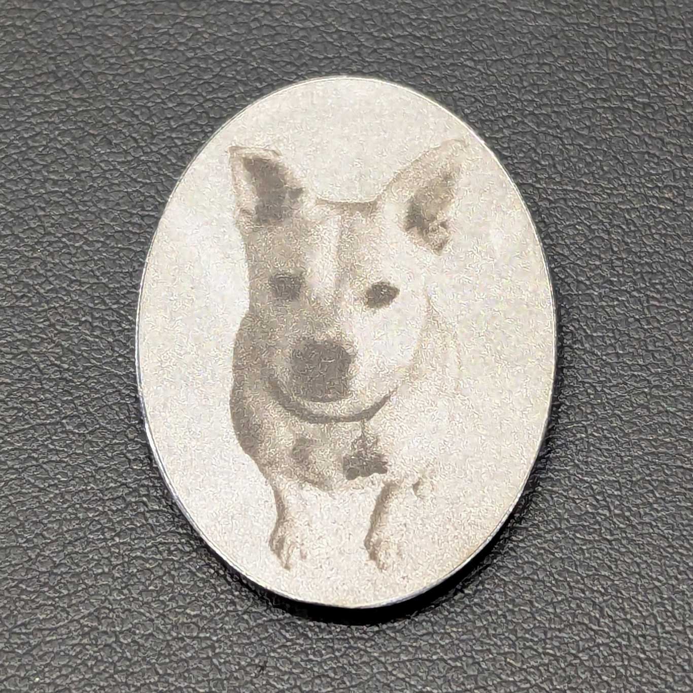 photo of dog laser engraved onto sterling silver oval pendant
