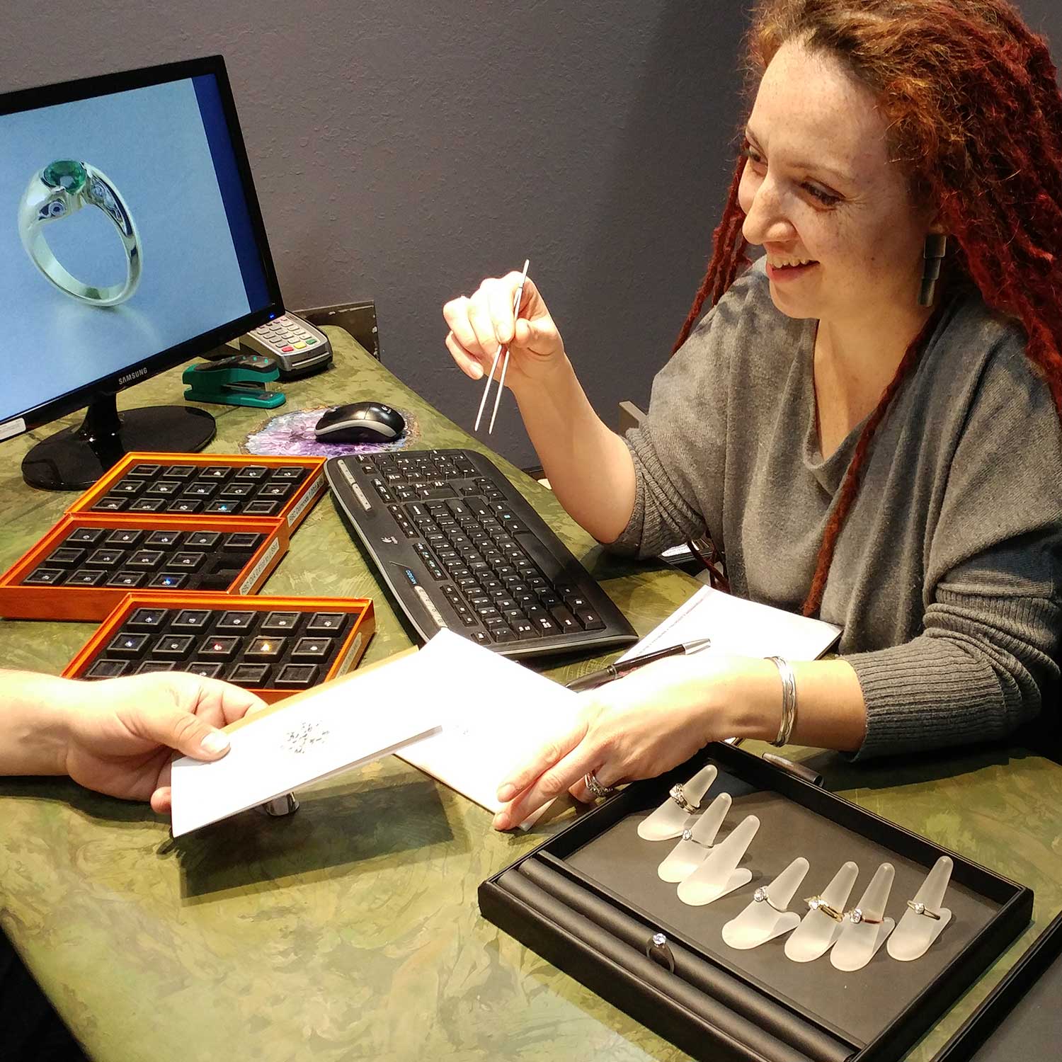 Design consultation with Mary at desk with sketch and client