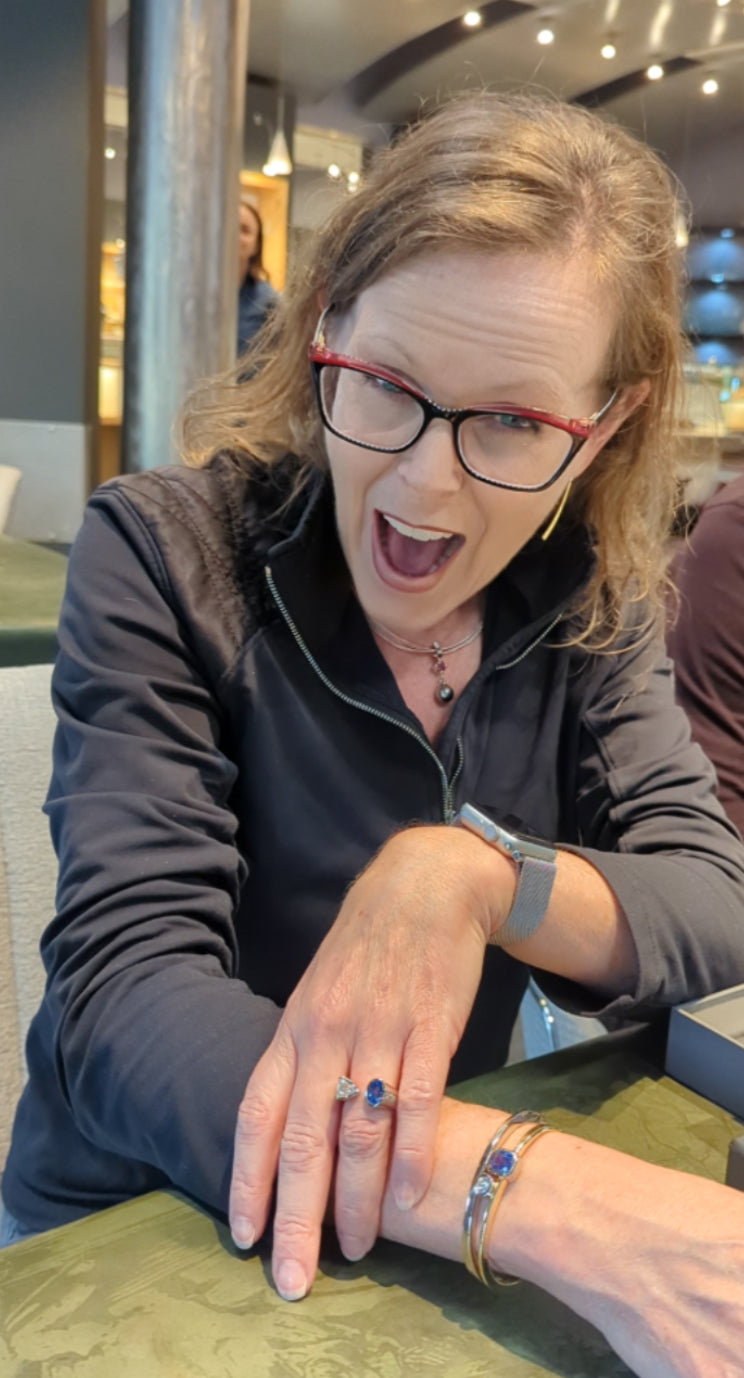 Happy client showing off her new handcrafted custom kissing ring, Jewelsmith Durham, NC