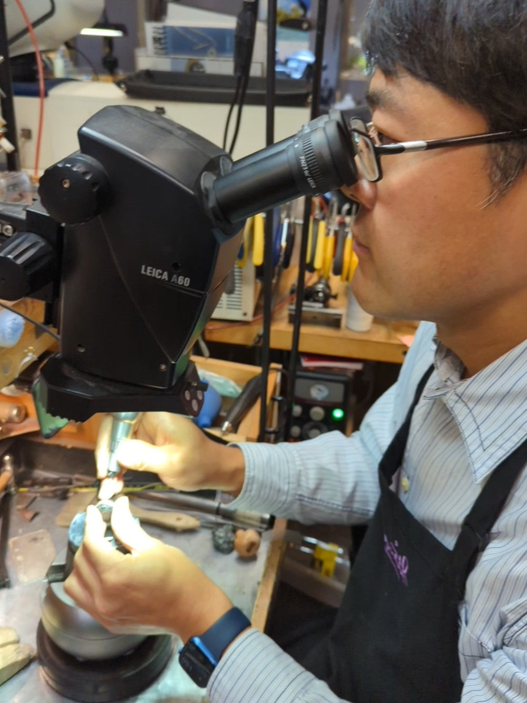 jeweler setting gemstones