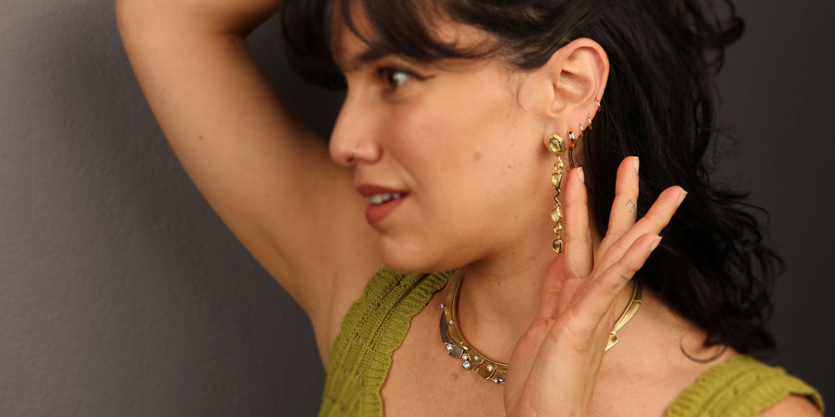 Model wearing new handcrafted necklace and earrings — Jewelsmith Durham NC