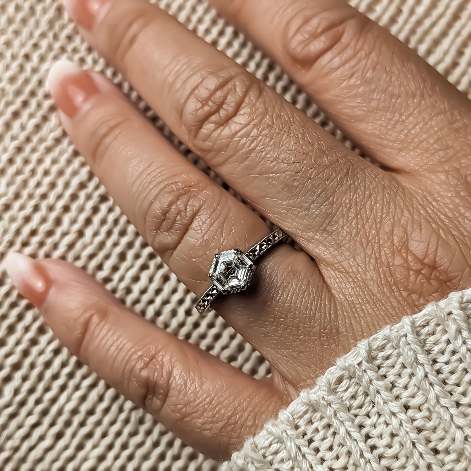 hexagonal diamond engagement ring on model