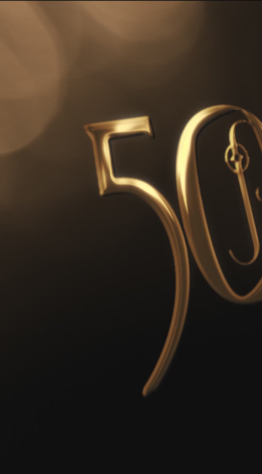 gold 50th anniversary logo panning across dark background with gold bokeh
